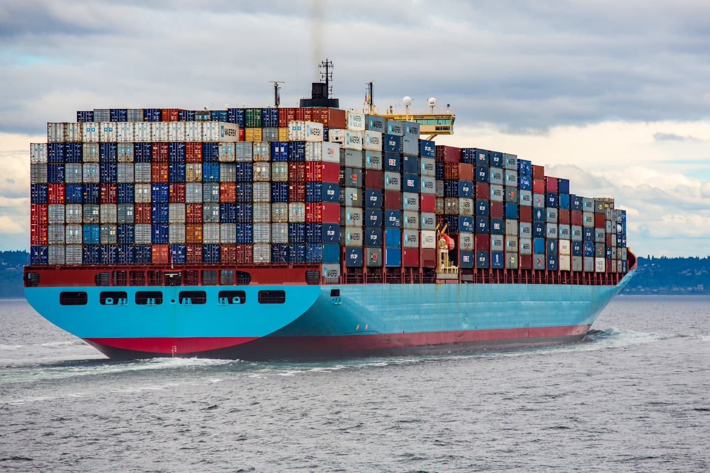 Shipping containers stacked at a freight terminal